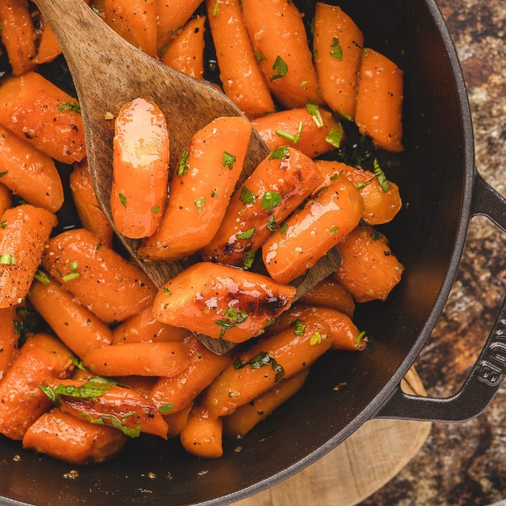 This roasted Honey Garlic Carrots recipe features a honey–garlic butter glaze and simple seasonings that highlight their natural sweetness. #honeygarliccarrots #honey #garlic #carrots #roastedcarrots #dinner #sidedish #Christmas #holidayseason melissassouthernstylekitchen.com/honey-roasted-…