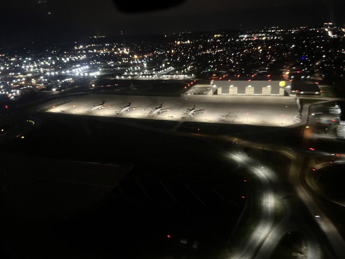 A little blurry because we rushed to take this when we saw the brief opportunity taking off from Louisville the other night. The most haunting aspect of it is the snow outline of a “missing” MD-11, reminds me of the missing man formation used by the military. Sad to see these