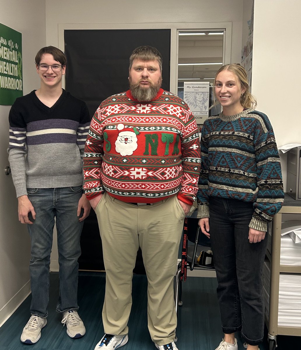 WarriorsCoachK's tweet photo. Day 8 of SWEATERMAS! Coach Gunderson and Landen sporting some nice vintage sweaters earn their way into a pic!! #SWEATERMAS https://t.co/J2PQrRVmzE