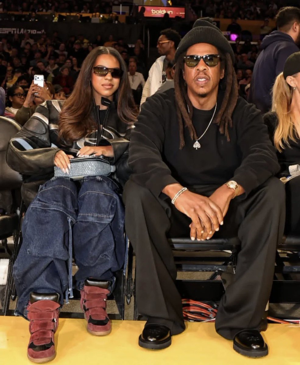 Blue Ivy and Jay-Z at the Lakers game tonight.