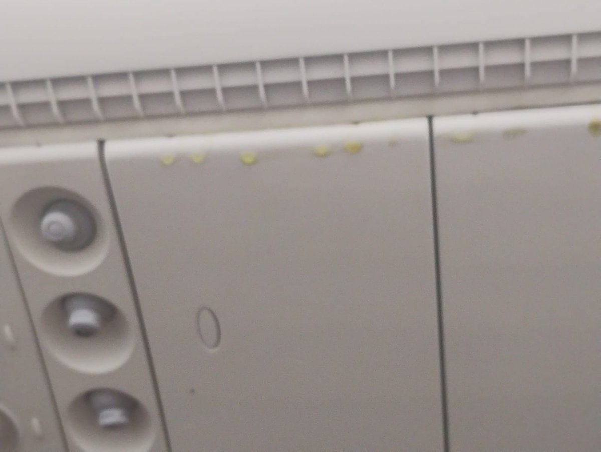 shefzin's tweet photo. @emirates Ek216 Lax-Dxb.. seat 61A... Some sort of chemical liquid dripping from the ceiling post landing. Pls have this addressed. https://t.co/e1Uq7bcjmD
