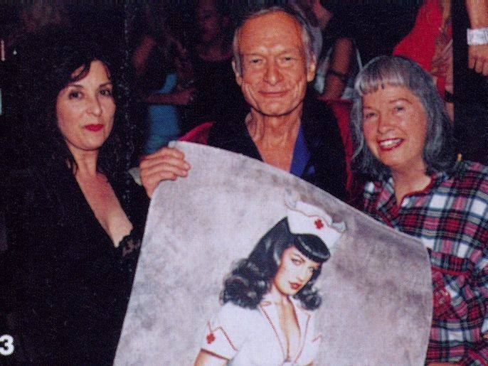 Remembering Bettie Page, 16 years on.
This was her last photo, at age 80, taken in 2003, alongside Hugh Hefner and artist Olivia De Berardinis.