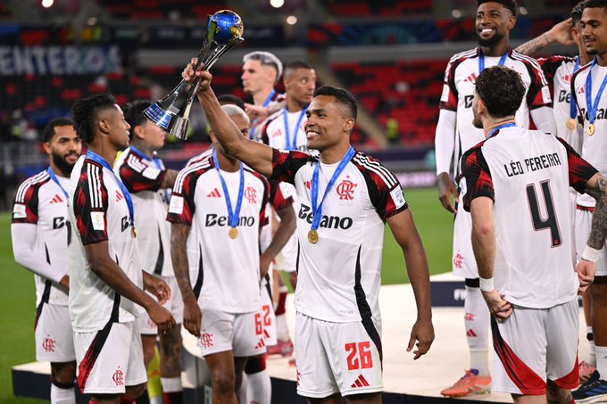Alex Sandro of CR Flamengo celebrates with the trophy after winning the FIFA Derby of the Americas 2025 match between Cruz Azul and CR Flamengo at Ahmad Bin Ali Stadium.