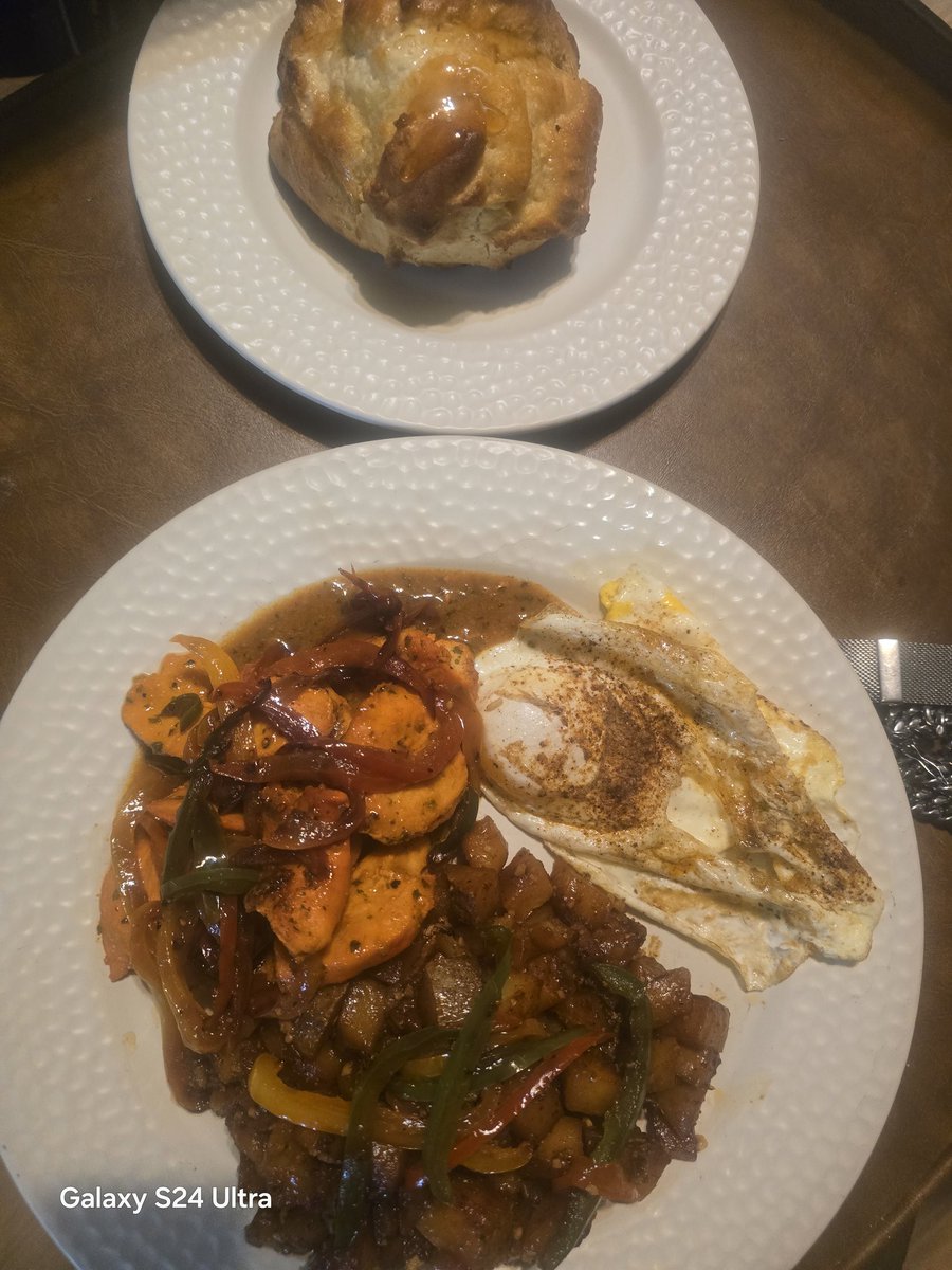 Homemade biscuits.  Nothing from the box  over medium eggs. TBone steak pan seared, sautéed onions and peppers. With country style potatoes and a chili lime sauce with some jalapeño oil added for extra kick. Enjoy... #DivineBreakfast