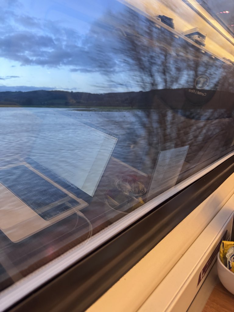 Hometime - travelling alongside flooded fields in the Welsh valleys after heavy rainfall