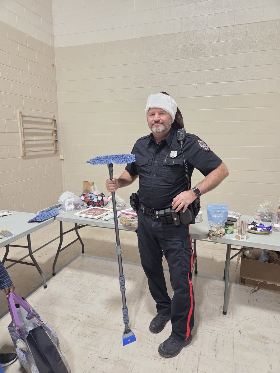 RPSCultural's tweet photo. Christmas Cheer 🎄 was at Rosemont School today at their Christmas shop! We were happy to help the students pick out gifts for their families and wrap them!  I think Regina Public Schools Chairperson, Sarah Cummings Truszkowski, had the better wrapping skills. https://t.co/eOMGzw3D80