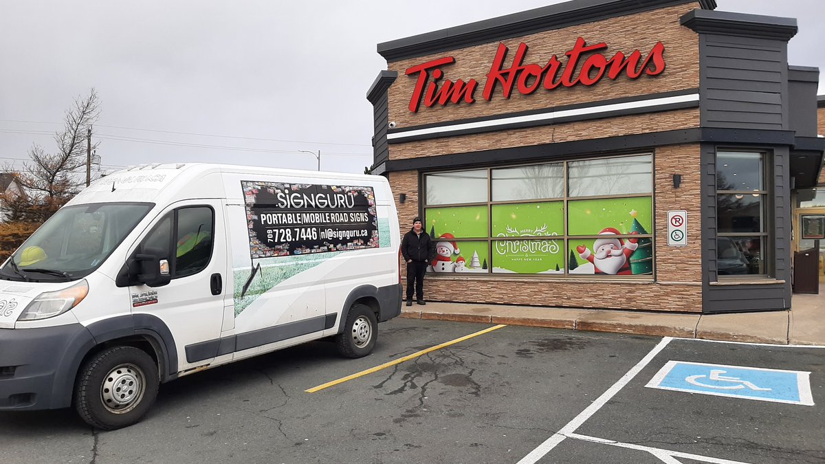 SignGuruNL's tweet image. Santa and the Elves are busy in the workshop at the North Pole and we've been busy as well in our workshop, with Tim Hortons Christmas windows.