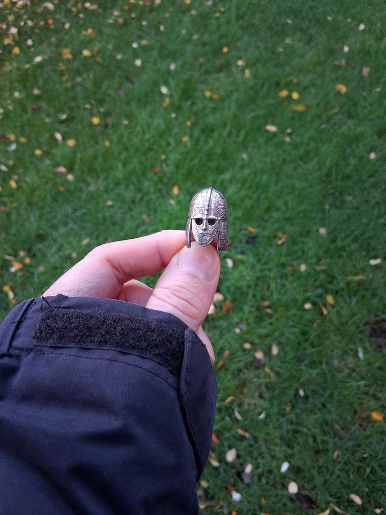 Not just a clue (and a stone holding it down in the wind) but a tiny Anglo-Saxon helmet too... Someone didn't follow the washing instructions on it. I hope the real one proves to be just a little bit bigger.