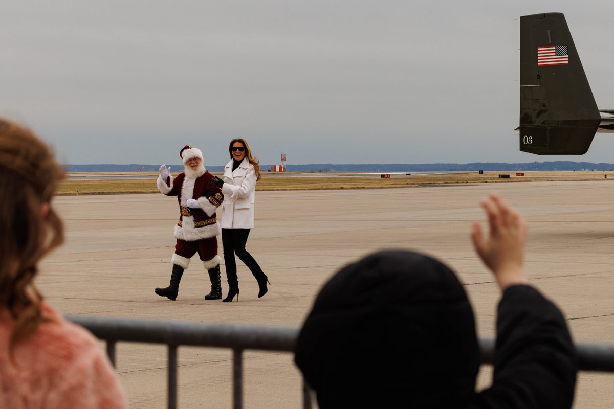 USMC's tweet image. First Lady Melania Trump, @FLOTUS, visits Marine Corps Base Quantico to take part in Toys for Tots alongside Marines and @USNavy Sailors.

Mrs. Trump told a story to children in attendance, helped sort toys for Toys for Tots, and assisted making Christmas cards. 

#MarineCorps…