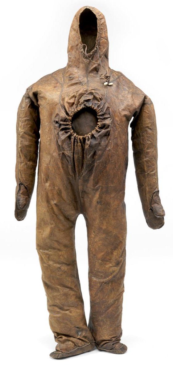 So this creepy looking brown leather onesie is actually a legit 19th century Inuit sealskin whaling suit from Greenland (pre-1834). It’s made entirely from sealskin, stitched with sinew, and that big hole in the chest...that’s the entrance. You’d step in feet first, pull it up