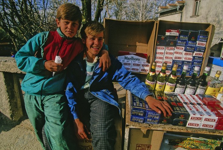 Two boys selling cigarettes and alcohol, Bosnia and Herzegovina, 1993.