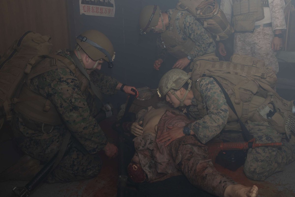 OkinawaMarines's tweet photo. U.S. Navy Hospital Corpsmen with @III MEF, participate in the culminating event of a Combat Medical Course.

CMC is key to improving tactical combat casualty care skills and building the confidence needed to perform lifesaving trauma under immense physical and mental pressure. https://t.co/bCAklRkPpB