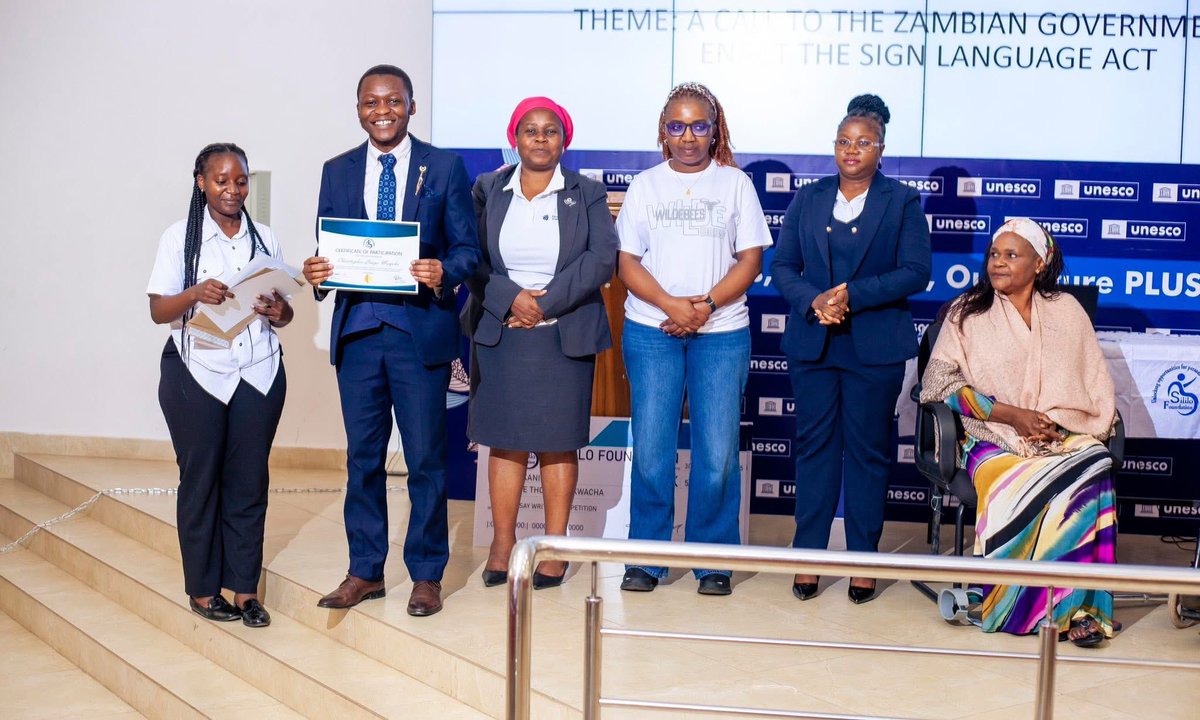 Sililo2020's tweet photo. A CALL TO THE ZAMBIAN GOVERNMENT TO ENACT THE SIGN LANGUAGE ACT

Picture Highlights of the Sililo Foundation 2025 Essay Writing Competition Awards Giving Ceremony held at the University of Zambia on October 30. 

A Call to the Zambian Government to Enact the Sign Language Act! https://t.co/kiEShNNTod