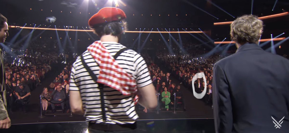 shadowmind665's tweet image. It's just some random guy, so hold your horses, cowboy. 
Kojima™ was sitting on the other side. Stop fueling the spiral of "hatred".