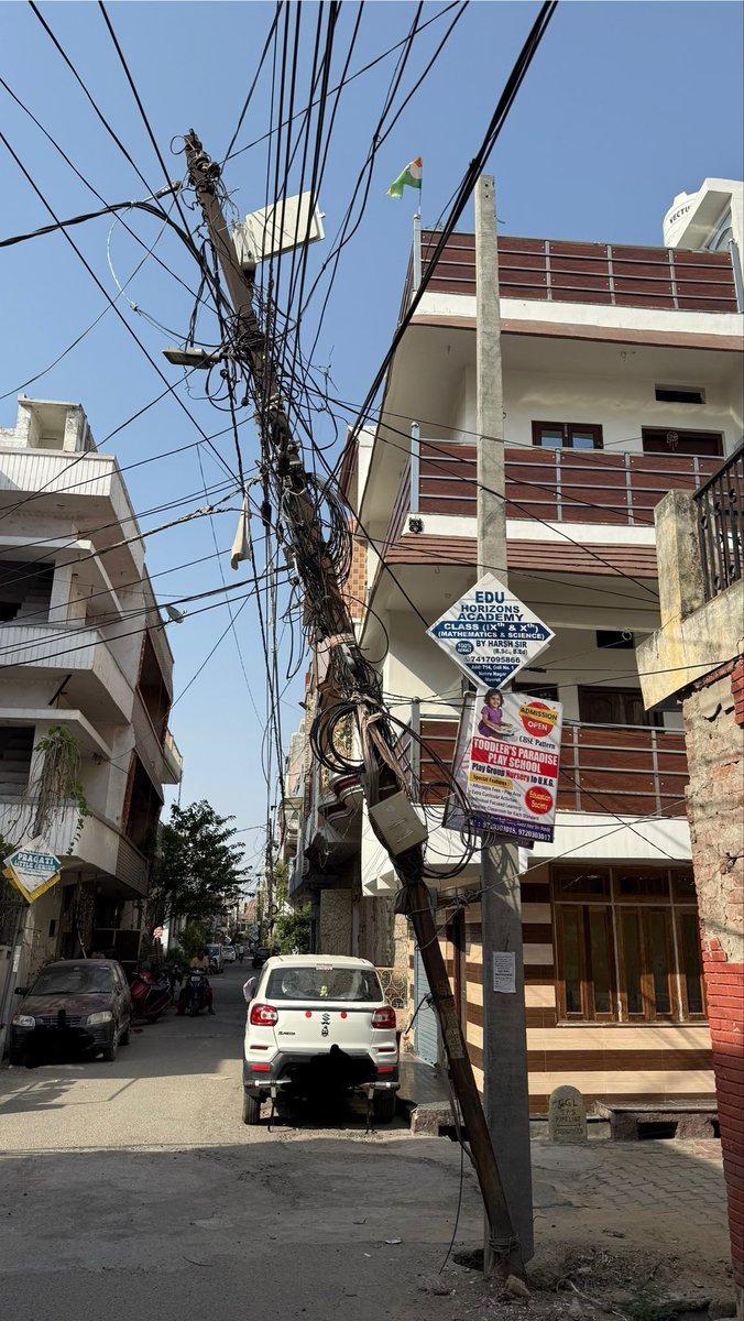 vishrash's tweet photo. This electricity pole located in Street 3, Nehru Nagar, Meerut is dangerously tilted for last 8 months and can be fatal to residents. This photo is from April this year. No action after multiple requests. Kindly look into this matter urgently which is already delayed. https://t.co/ghbhPJ1DM3
