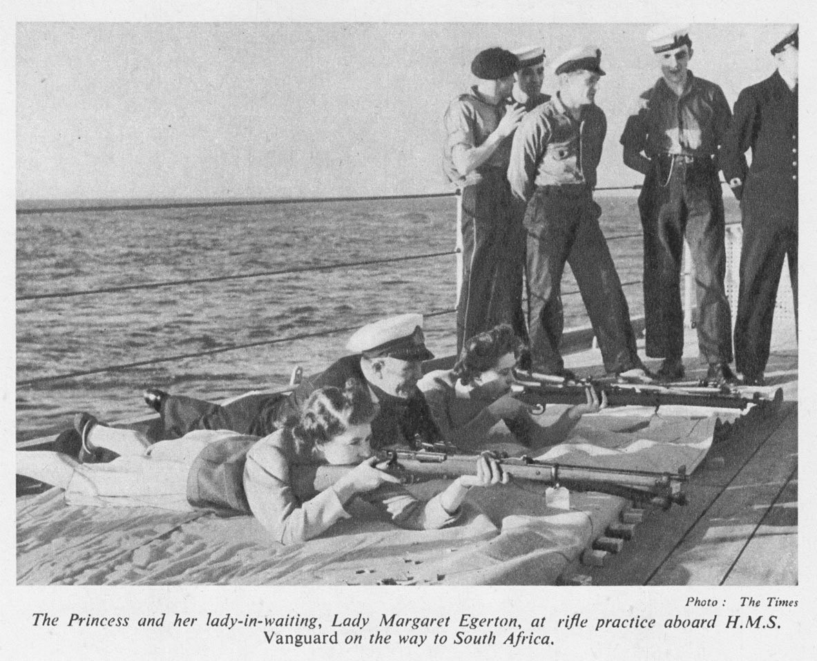 I present to you a photograph of the Queen of England II - holding a gun