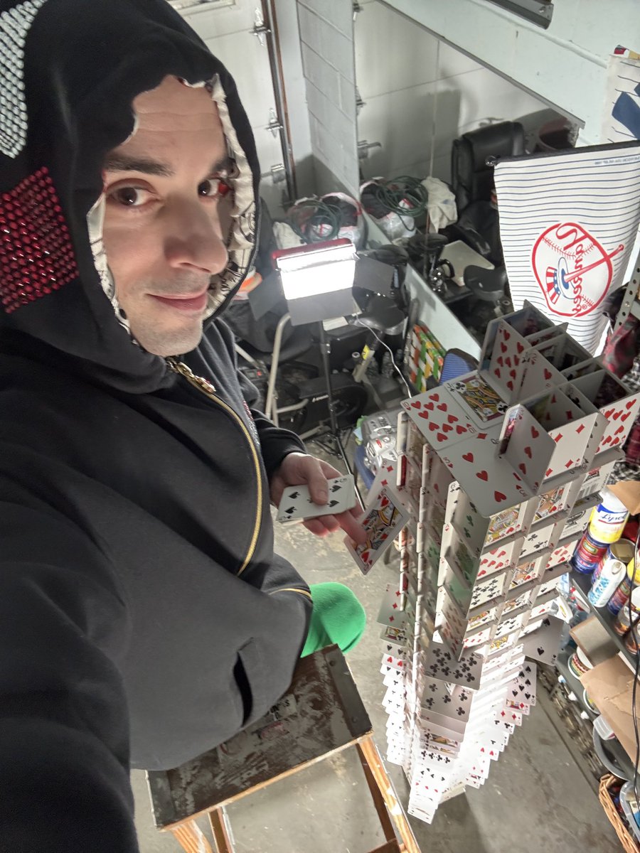 AlexTheCardman's tweet photo. I may always be limited by the height of the ceiling. But never by the ceiling of my imagination: https://t.co/MK3ajORHzO #cardstacker #cardtower #houseofcards https://t.co/8HTPl88Gvj
