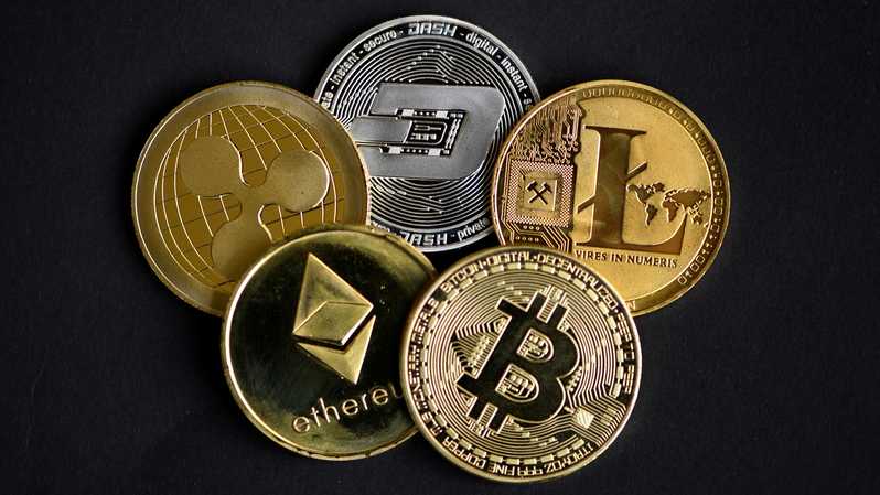 Assortment of cryptocurrency coins including Bitcoin, Ethereum, and others