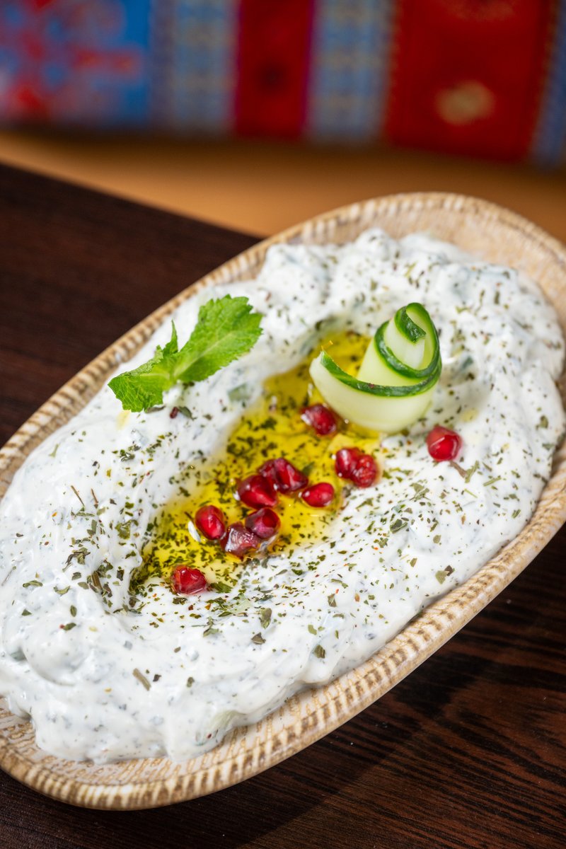 CyprusMangal's tweet image. Enjoy the refreshing flavours of our creamy yoghurt meze, topped with fresh herbs, olive oil, and vibrant pomegranate seeds. A light and delicious taste of authentic Mediterranean cuisine, perfect as a starter or side to our charcoal grills.
#CyprusMangal #MediterraneanFlavours