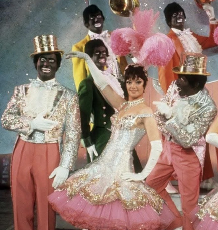 juneslater17's tweet image. The BBC  quick to report alleged antisemitic  comments  by  Nigel Farage  as a schoolboy.
This is a scene from a well known BBC show around the same time called 
The Black n White Minstrals.