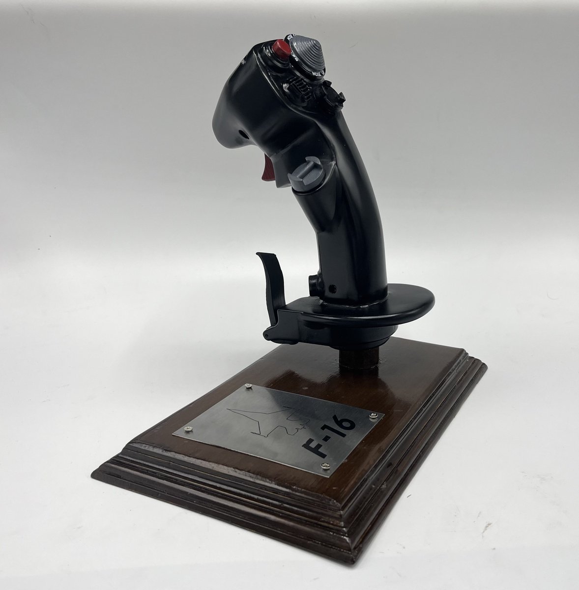 Bring the thrill of modern fighter aviation into your collection. This meticulously crafted full-scale replica of the F-16 Fighting Falcon control stick from MK Hobbies captures every contour, switch, and detail of the real flight-control system used in F-16.