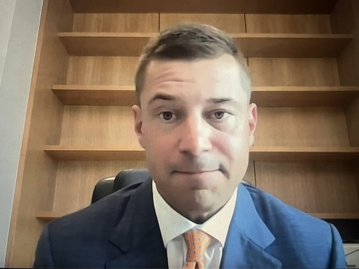 Jon Sumrall reps an orange and blue tie for the American Conference Championship media availability