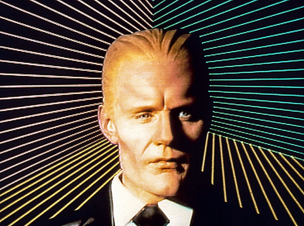 Knowledgepoint's tweet image. Max Headroom the artificial intelligence (AI) character from 1980s television, known for his stuttering speech, witty, arrogant personality, and satirical commentary. His name originates from the last thing he sees before a motorcycle crash: the barrier sign &quot;MAXIMUM HEADROOM&quot;