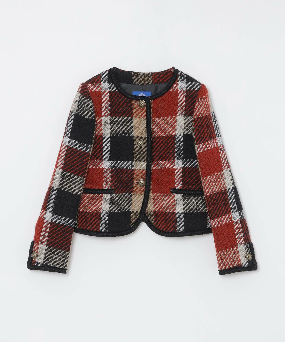 10th ANNIVERSARYアイテムのノーカラージャケットとスカート。クレスト