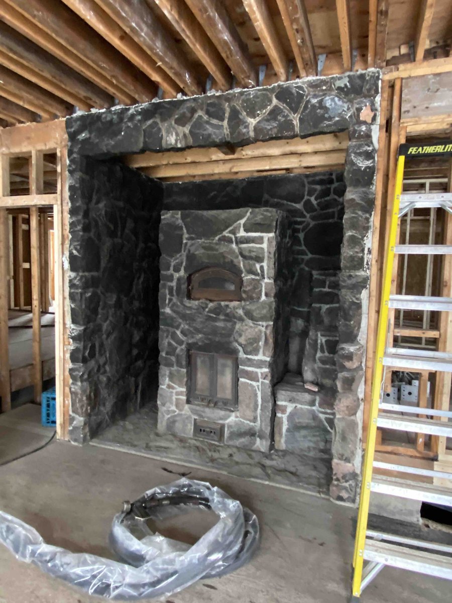 We're so proud of the results after restoring this original stone fireplace that was at the center of a family home that suffered severe fire damage. Our team meticulously removed layers of soot from every rock and grout line during the restoration. Beautiful results!