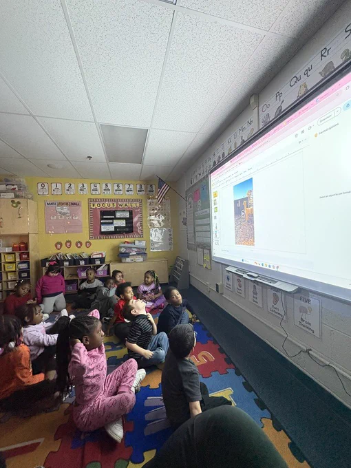 Students watching a video about the farm