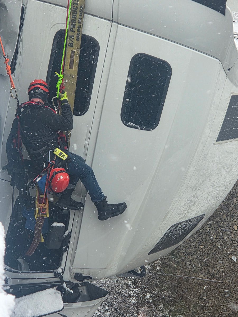 AnthonyWCHS's tweet photo. Here’s some incredible photos of today’s rescue along Rt 35 in Mason County. Crews used ropes to rescue the driver while his cab dangled over a bridge at Sixteen Mile Rd. The driver was stuck in there for five hours, but refused medical treatment. 
📸: St Albans FD &amp; Vickie Flora https://t.co/AmkjAou2GR