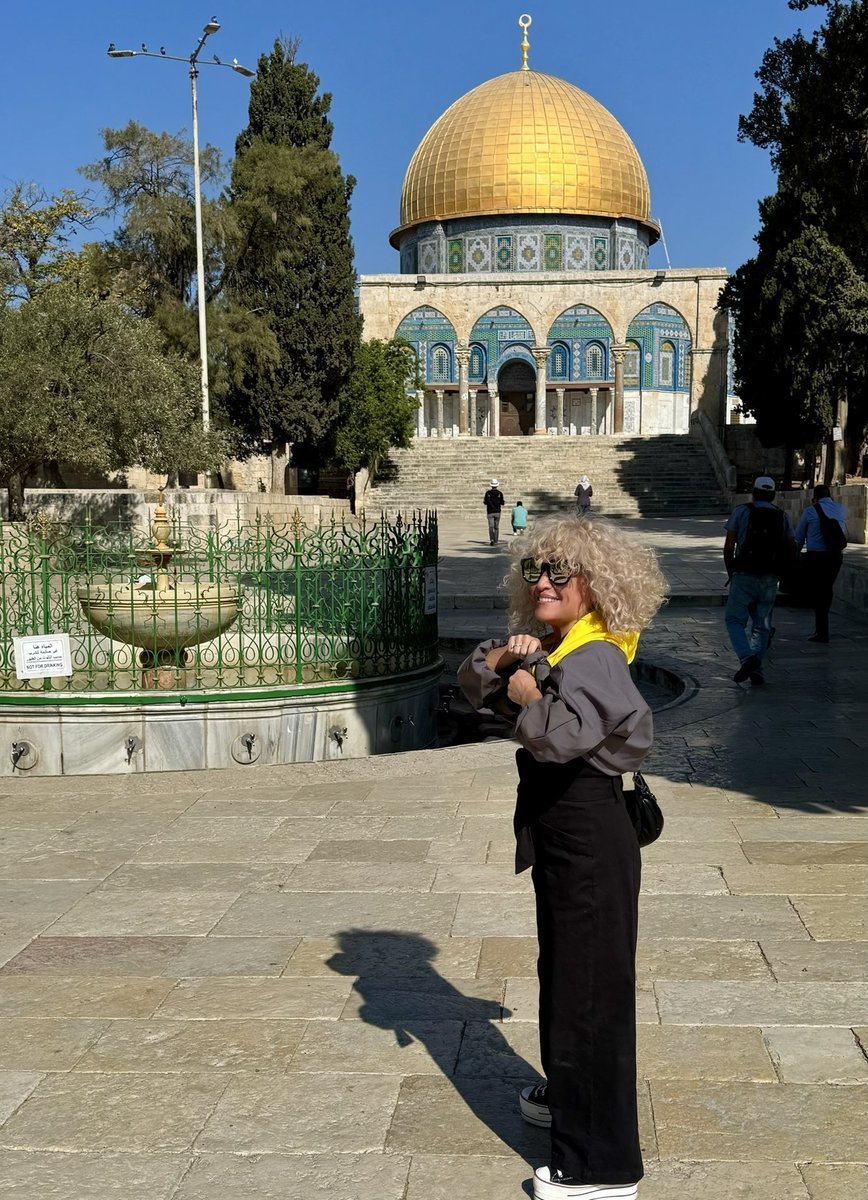DahliaKurtz's tweet photo. When I visited the Al-Aqsa occupied Temple Mount, I was ordered to wear a tent-like burqa.

Of course, I wore it — with a Dahlia-style modification. See the yellow hooded "jacket" I'm wearing? 

I call my design, "Free Will."

I encourage you to try it. It's so liberating! https://t.co/pqdxz7kfig