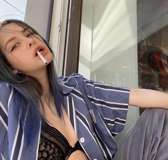 Understated ruin.
Borderline divine.
Smoke as her only accessory.