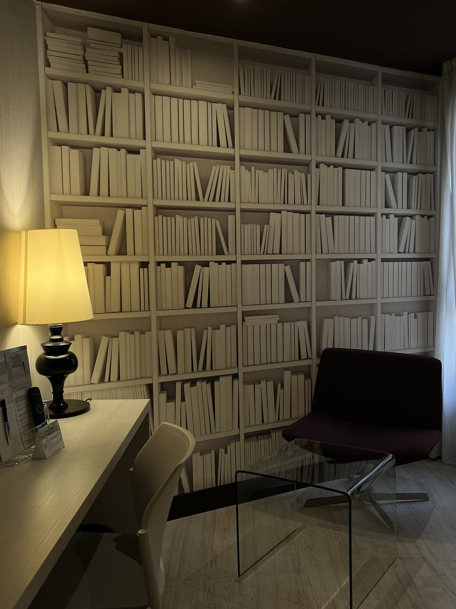 chriserikthomas's tweet image. In Bilbao for a final assignment for the year and was not ideologically prepared for the aesthetic bookcase wallpaper