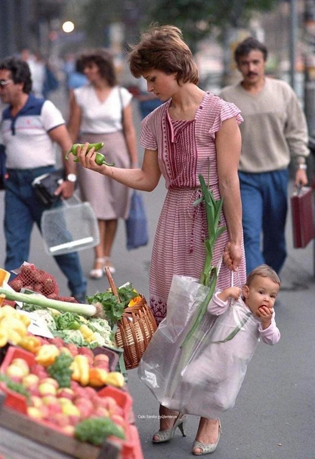 historyinmemes's tweet image. A mother and her daughter at a Budapest market in 1987, and the same pair at a Budapest market in 2020.