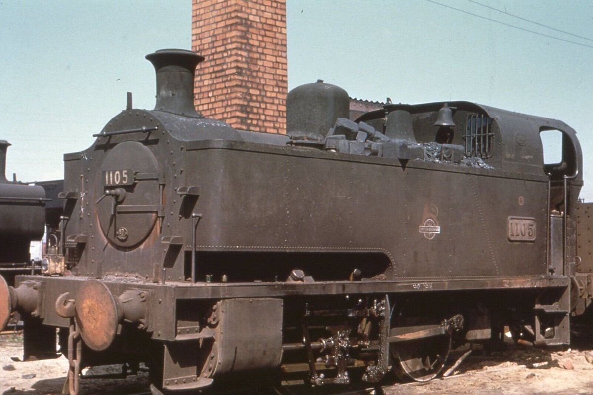 Coated in a layer of rust &amp; grime with rather sagging buffers, 1101 1105 is shot by Terence B. Owen on shed at Danygraig in April 1955. With a spark arrestor &amp; bell, 1105 had worked Swansea Docks its entire life having been built for the job - evident by its 6ft6in wheelbase.