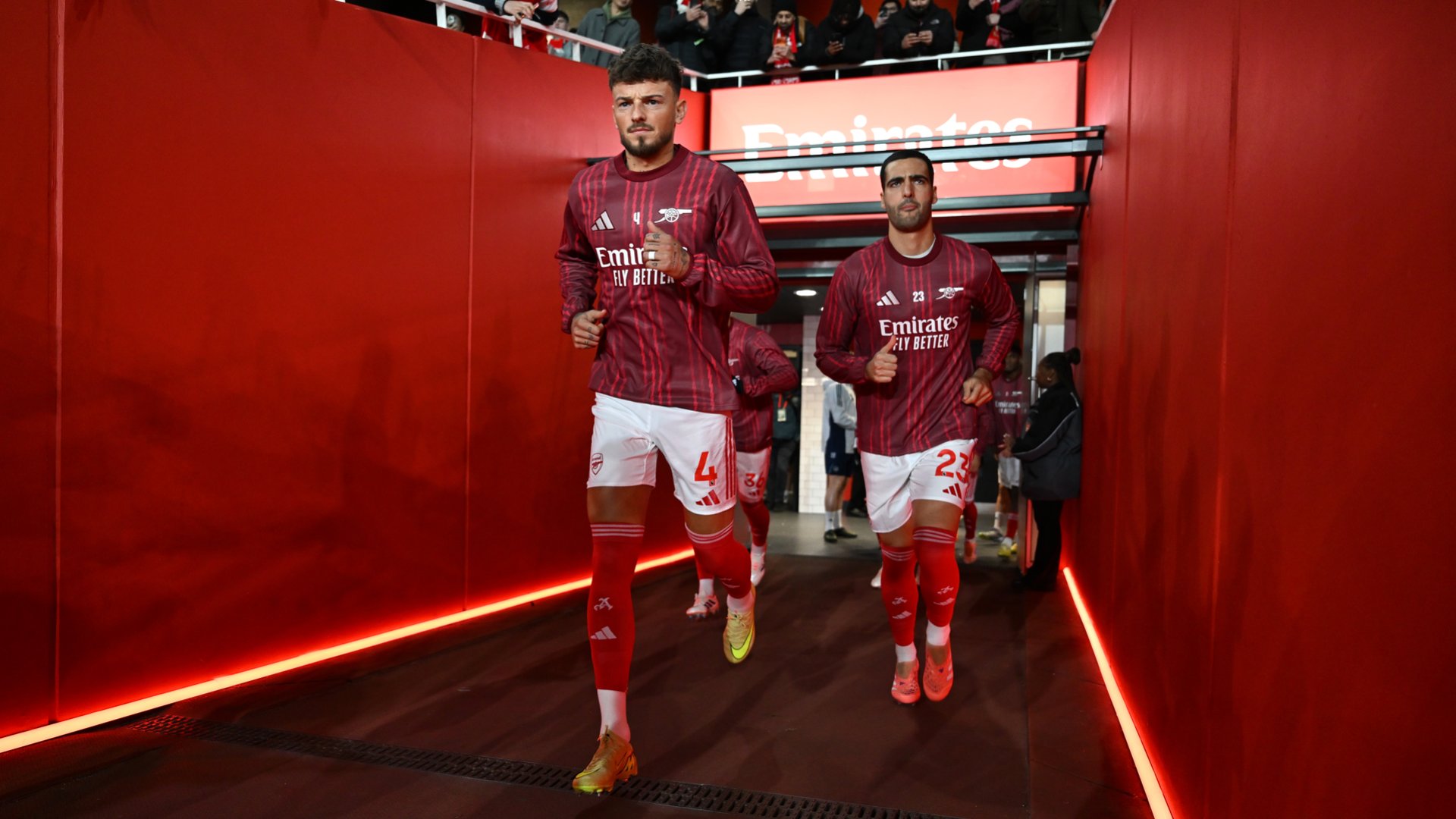 Ben White and Mikel Merino running out for the warm-up.