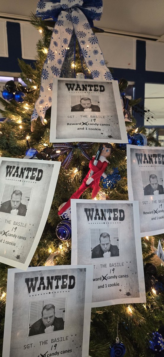 The Elf is offering candy canes and cookies for anyone helping get this guy into the Christmas Spirit.