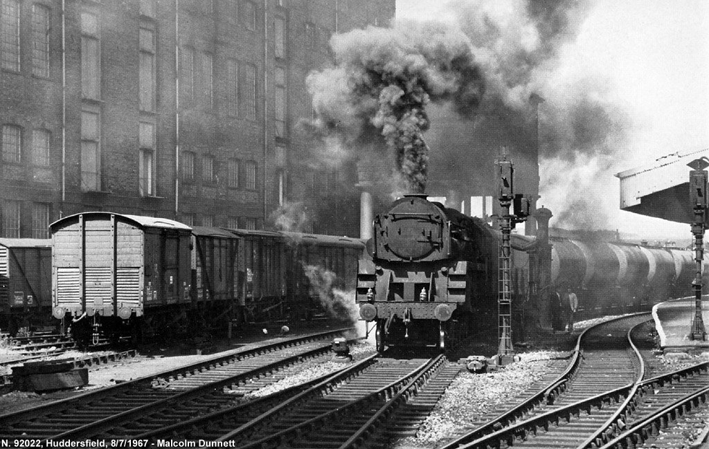 Crosti-boilered 2-10-0 No. 92022, pauses for water at Huddersfield on July 8, 1967.

Malcolm Dunnett