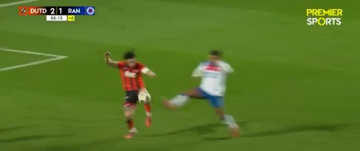 Studs up at knee level, lunging in, falls over. 

Penalty Rangers* of course 🤣🤣
