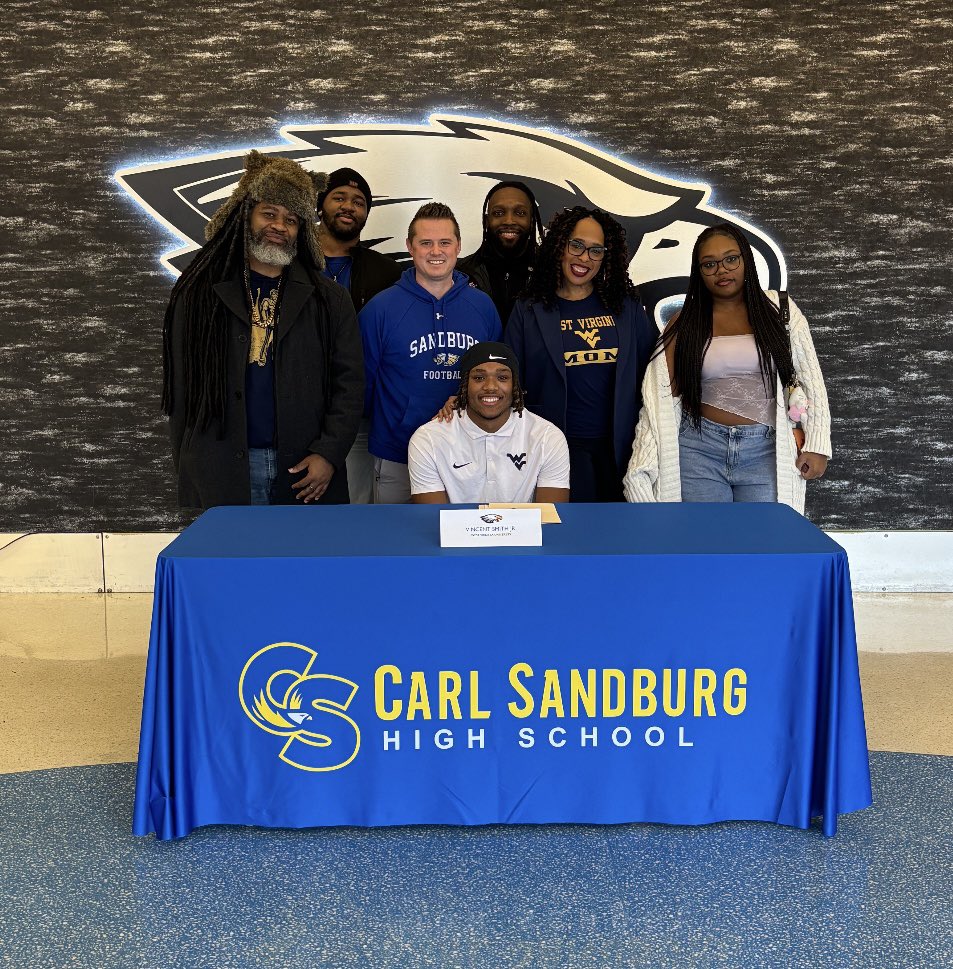 Another special day in Orland Park this week as Senior DB Vincent Smith signed his national LOI with WVU today! <a href="/vincentxii__/">Vincent Smith</a> <a href="/WVUfootball/">West Virginia Football</a> 

<a href="/EDGYTIM/">Timothy “EDGYTIM” OHalloran</a> <a href="/thesouc/">Steve Soucie</a> <a href="/Millar_S/">Steve Millar</a> <a href="/JeffVorva/">Jeff Vorva</a> <a href="/mikeclarkpreps/">MikeClarkPreps</a> <a href="/michaelsobrien/">Michael O'Brien</a> <a href="/EaglesAthletics/">Sandburg Athletics</a> <a href="/SandburgHS/">Carl Sandburg H.S.</a> 

#CountryRoads ⛰️ 
#FlyWithUs 🟡🔵🦅🏈