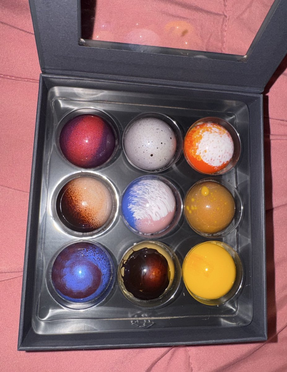 Picked up some really pretty chocolates at the airport! They each look like miniature galaxies!