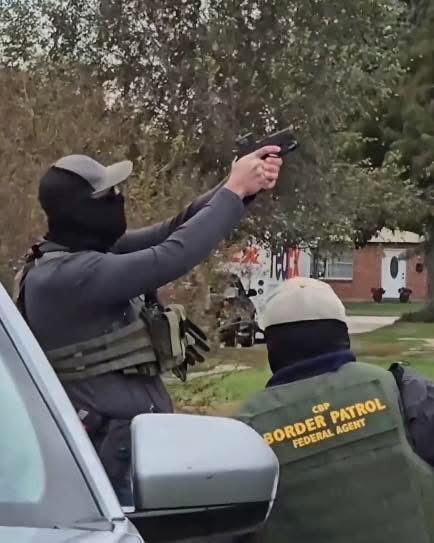 Timodc's tweet image. Masked fucks pointing weapons at roofers outside New Orleans. No probable cause just targeting Hispanics working construction.