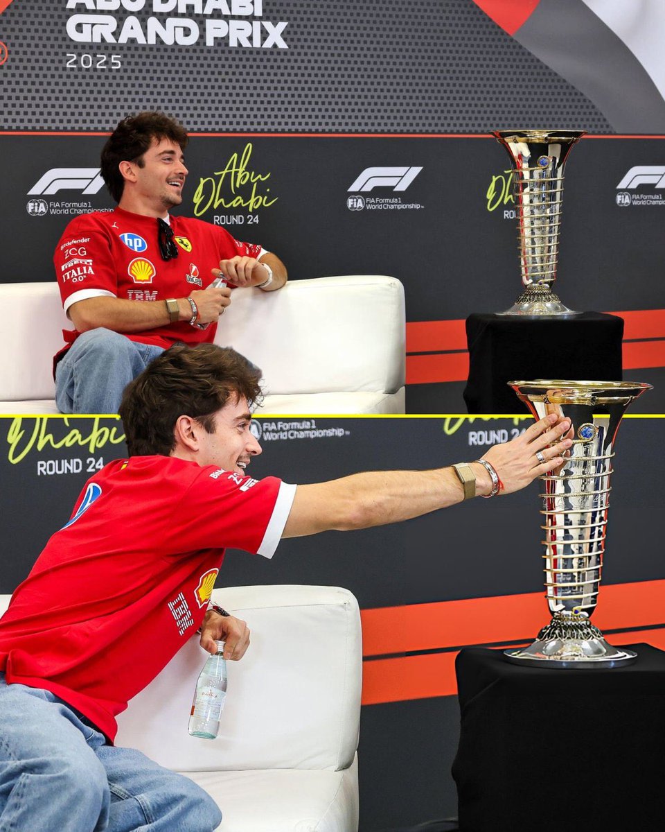 Charles Leclerc having a feel for the Drivers’ Championship trophy.

One day, Charles 🥹