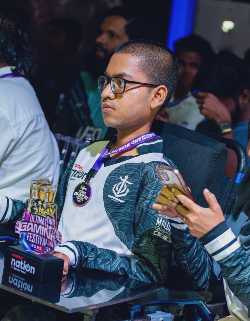 NuhIbrahimLNN's tweet photo. Mohamed Raishan Ahmed lives with spinal muscular atrophy type 2, a condition that gradually weakens motor neurons and limits physical movement. Over the years, this has confined him to a wheelchair and steadily reduced his physical strength. Even so, he has consistently demonstrated strong discipline and capability in esports.

He began playing Dota 2 casually in 2015, but as his arm strength declined, he transitioned to mobile gaming. When PUBG Mobile was released in 2018, he joined his friend Ahmed Asham Firaz (Bezerke) and later developed into one of the most effective in-game leaders (IGLs) in the region. By 2020, he had established himself both locally and internationally, leading Team OPZ through regional competitions and earning multiple wins despite the challenges he faces as a person with disability.

After retiring from PUBG Mobile esports and leaving a mark under the name “NagluBaglu,” he shifted to Mobile Legends: Bang Bang in 2021. There, he continues to excel as one of the top EXP laners in the Maldives. Beyond his own gameplay, he has trained well-known players such as Amaaneo and Bathalu, contributing significantly to the growth of Maldivian esports. His influence extends to commentary and event organization, and in 2024 he was recognized as Ooredoo Nation’s Best Caster of the Year at the Ultimate Gaming Festival.

Despite the obstacles posed by his condition, he remains active, consistent, and impactful, continuing to contribute to the community without being held back by his disability.

#eSportsMaldives #GamersUnite #Maldives #InternationalDayOfPersonswithDisabilities