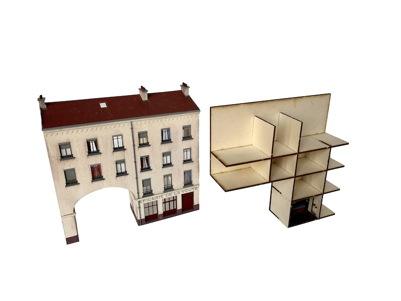 Le passage de la voûte s’inspire d’un immeuble du quartier de la Guillotière à Lyon qui a la particularité de s'ouvrir sur une rue par un voûte. C’est un modèle de fond de décor à l’échelle Ho. Maquettes à peindre et à monter à l’échelle Ho-1/87. axelsbazar.com