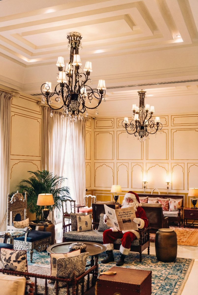 The grandeur of Jai Mahal Palace feels gently stirred, as if touched by a festive breeze.
Hints of red velvet and winter white are beginning to grace our regal spaces — cascading along carved balconies, nestled beside floral courtyards, and shimmering in the hush of twilight.