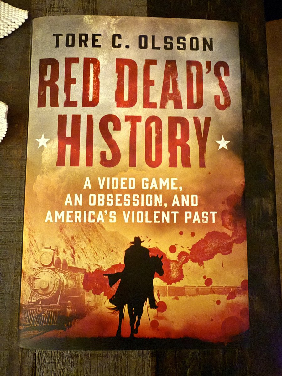 RussACross's tweet photo. Recently finished Red Dead’s History by Tore C. Olsson. Special thanks to @deeperdailypods for the gift.

The core history is absolutely gripping—packed with details from the real Old West that Rockstar drew from. Note: the game is really just a backdrop for this history book.

Only real gripe: a few SJW asides, race-obsessed jabs at “self-important white men,” selective inclusivity scolding, and the inevitable Black/white capitalization double-standard. Those moments pull you out of an otherwise excellent ride.