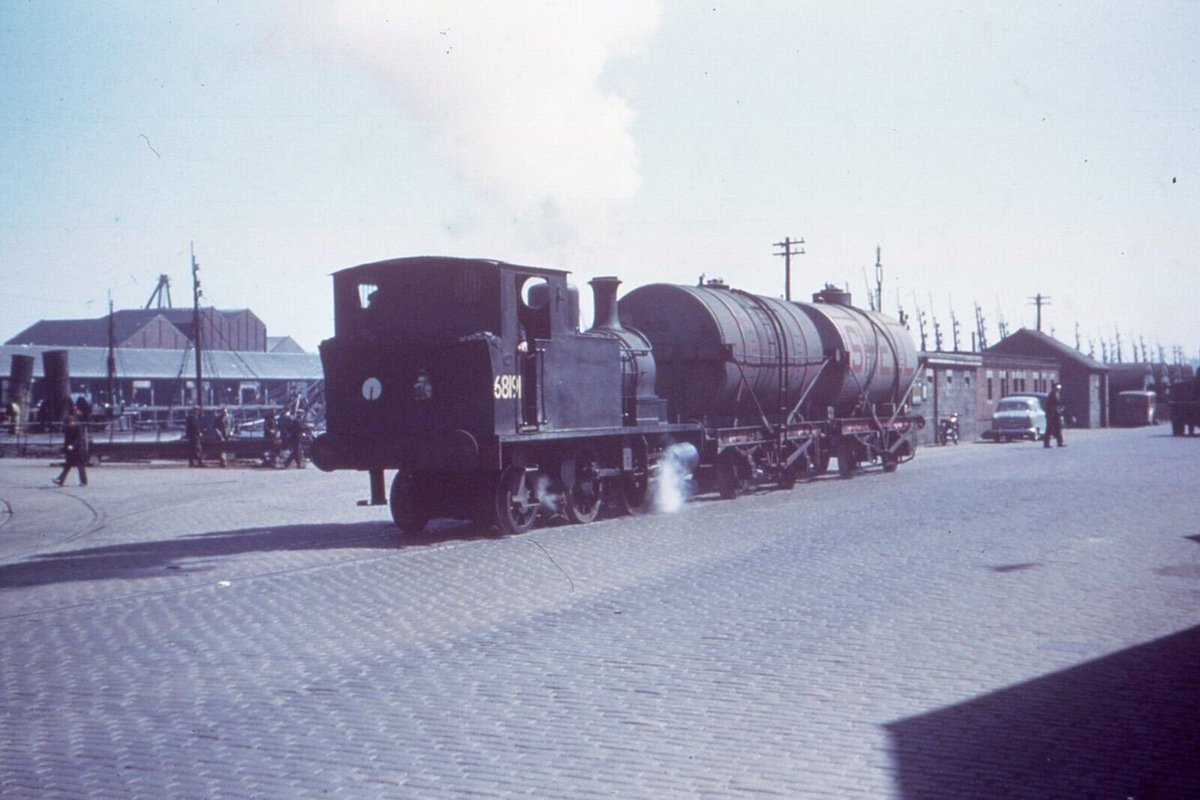 Still in plain wartime black with a cramped number on its bunker,  Z4 68191 traverses the Aberdeen Quayside with two tankers in May 1955. 68191's last visit to Inverurie had been in July 1951 &amp; it had languished in store at Kittybrewster from 12th July 1954 to 2nd February 1955.