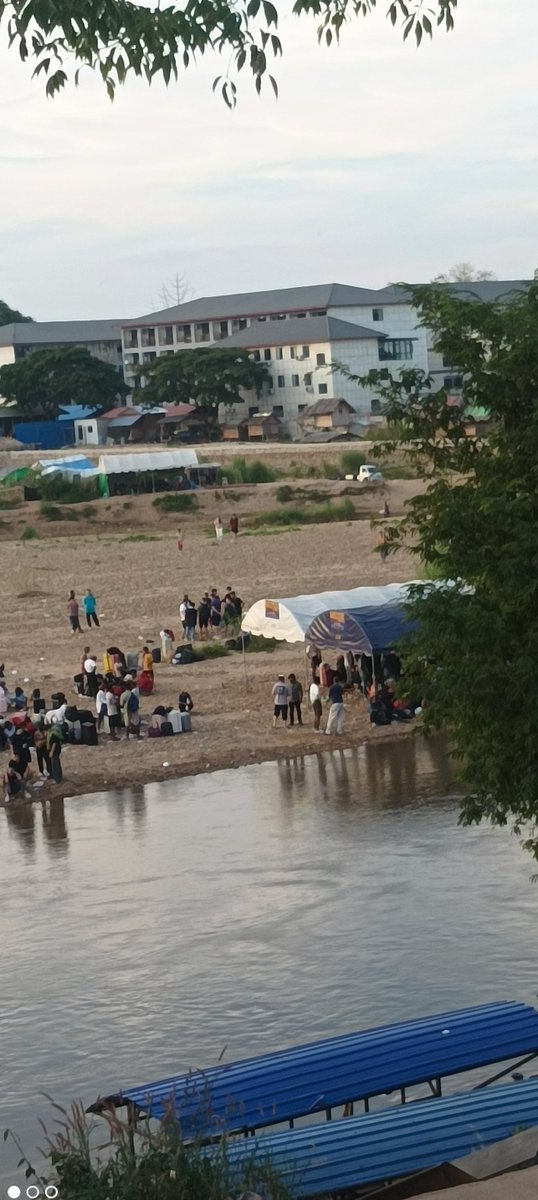 ScamCenterOrg's tweet photo. Recently updated situation at the Shunda Scam Compound
(https://t.co/c8cnOUNQlb)

KNU forces are now guarding the Shunda compound, where over 1,000 people are still trapped inside. Many victims fear they may soon be resold to other scam compounds, a pattern already seen with groups transferred from the “Great Demon” compound.

Around 600 victims managed to reach the river and cross into Thailand, yet many remain stranded along the riverbank.
Despite the fact that most of these individuals were originally trafficked through Thailand into Myanmar’s scam centers, Thai authorities are now refusing entry to many of them.

Some people have escaped by paying “protection fees” and traveling through established smuggling routes from Myawaddy into Thailand, before being moved toward Cambodia, where trafficking networks remain highly active and well-organized.

Only a handful of media outlets are reporting on this humanitarian crisis.
This global indifference is not just negligence — it enables harsher retaliation, more kidnappings, more trafficking, and the continued expansion of these transnational scam compounds.

The crisis is escalating.And the world is still looking away. 

#HumanTrafficking #ScamCompounds #Myanmar #Thailand #KNU #MaeSot #Cambodia #HumanRights